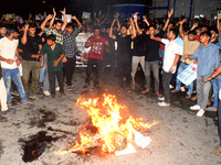 Trainee doctors, doctors, youths, and women are shouting slogans prior to burning an effigy of the Kolkata RG Kar Principal as part of a pro...