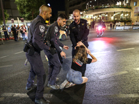 Israeli police officers are moving demonstrators blocking a street during a protest in Jerusalem, Israel, on August 20, 2024. People are gat...