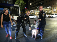 Israeli police officers are moving demonstrators blocking a street during a protest in Jerusalem, Israel, on August 20, 2024. People are gat...