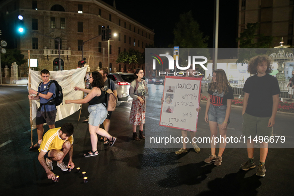 Israeli police officers are moving demonstrators blocking a street during a protest in Jerusalem, Israel, on August 20, 2024. People are gat...