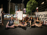 Israeli police officers are moving demonstrators blocking a street during a protest in Jerusalem, Israel, on August 20, 2024. People are gat...