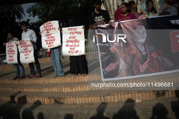 Tribal students of Dhaka University are holding a rally with a banner displaying a portrait of Kalpana Chakma in Dhaka, Bangladesh, on Augus...