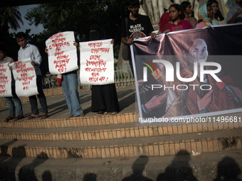 Tribal students of Dhaka University are holding a rally with a banner displaying a portrait of Kalpana Chakma in Dhaka, Bangladesh, on Augus...