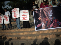 Tribal students of Dhaka University are holding a rally with a banner displaying a portrait of Kalpana Chakma in Dhaka, Bangladesh, on Augus...