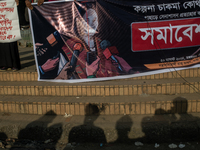 Tribal students of Dhaka University are holding a rally with a banner displaying a portrait of Kalpana Chakma in Dhaka, Bangladesh, on Augus...