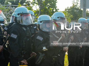 Riot police during the pro-Palestine protest on the first day of the Democratic National Convention on August 19, 2024. The protesters march...