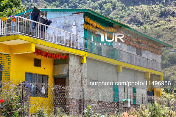 Corn is hanging outside a home in the Sainji Village (Corn Village) in Mussoorie, Uttarakhand, India, on April 18, 2024. This village is fam...