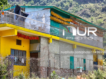 Corn is hanging outside a home in the Sainji Village (Corn Village) in Mussoorie, Uttarakhand, India, on April 18, 2024. This village is fam...