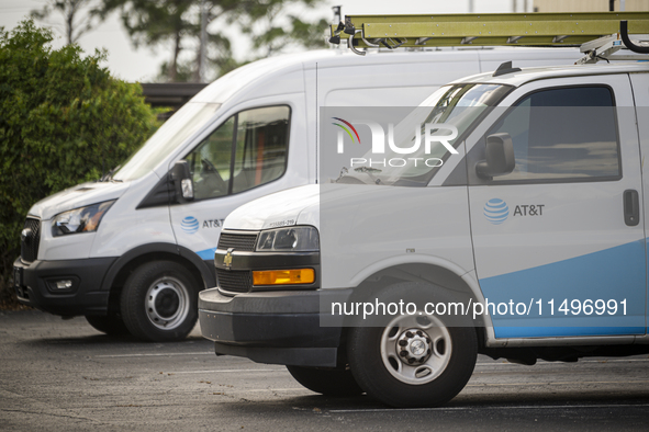 An AT&T logo is adorning a worker's van in Daytona Beach, Florida, on August 20, 2024. The strike, which began last Friday, is involving mor...