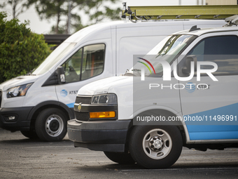 An AT&T logo is adorning a worker's van in Daytona Beach, Florida, on August 20, 2024. The strike, which began last Friday, is involving mor...