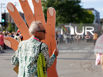 A demonstrator carries a prop near an entrance to the Democratic National Convention in Chicago, Illinois on August 20, 2024. (