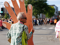 A demonstrator carries a prop near an entrance to the Democratic National Convention in Chicago, Illinois on August 20, 2024. (