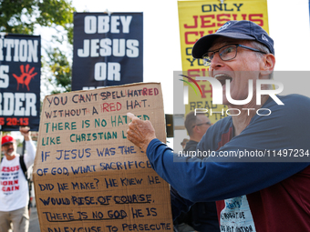 Opposing abortion rights demonstrators protest at an entrance to the Democratic National Convention in Chicago, Illinois on August 20, 2024....