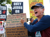 Opposing abortion rights demonstrators protest at an entrance to the Democratic National Convention in Chicago, Illinois on August 20, 2024....