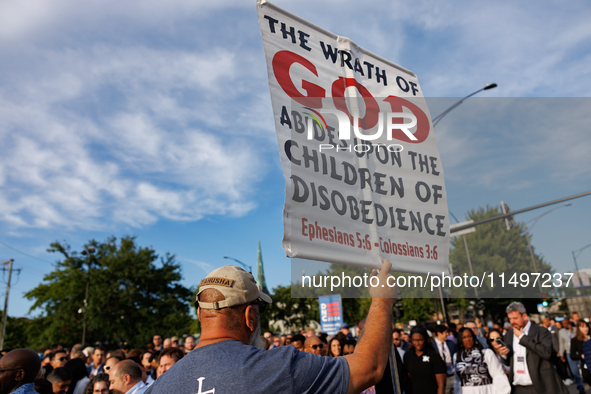 An anti-abortion rights demonstrator protests at an entrance to the Democratic National Convention in Chicago, Illinois on August 20, 2024. 