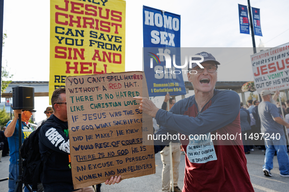 Opposing abortion rights demonstrators protest at an entrance to the Democratic National Convention in Chicago, Illinois on August 20, 2024....