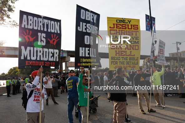 Anti-abortion rights demonstrators gather at an entrance to the Democratic National Convention in Chicago, Illinois on August 20, 2024. 