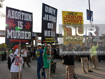 Anti-abortion rights demonstrators gather at an entrance to the Democratic National Convention in Chicago, Illinois on August 20, 2024. (