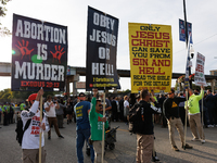 Anti-abortion rights demonstrators gather at an entrance to the Democratic National Convention in Chicago, Illinois on August 20, 2024. (