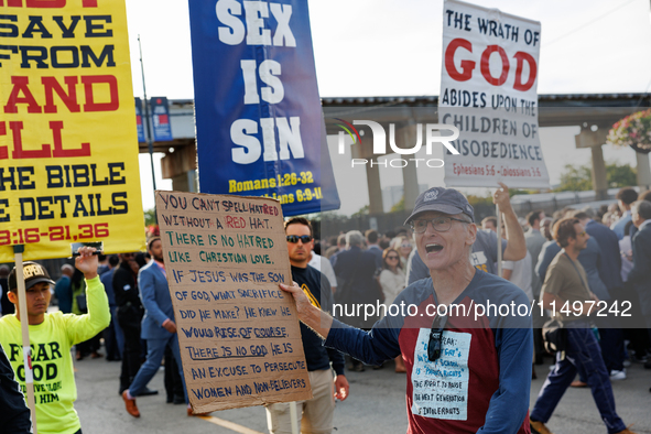 Opposing abortion rights demonstrators protest at an entrance to the Democratic National Convention in Chicago, Illinois on August 20, 2024....