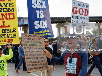 Opposing abortion rights demonstrators protest at an entrance to the Democratic National Convention in Chicago, Illinois on August 20, 2024....