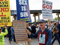 Opposing abortion rights demonstrators protest at an entrance to the Democratic National Convention in Chicago, Illinois on August 20, 2024....