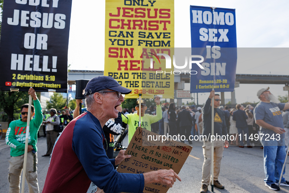 Opposing abortion rights demonstrators protest at an entrance to the Democratic National Convention in Chicago, Illinois on August 20, 2024....