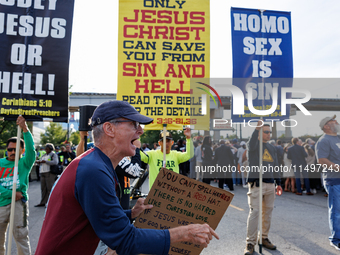 Opposing abortion rights demonstrators protest at an entrance to the Democratic National Convention in Chicago, Illinois on August 20, 2024....