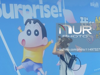 Visitors are watching the world's first VR movie ''Me and Crayon Shin-chan'' through multimedia smart VR glasses in Hangzhou, China, on Augu...