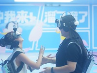 Visitors are watching the world's first VR movie ''Me and Crayon Shin-chan'' through multimedia smart VR glasses in Hangzhou, China, on Augu...