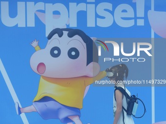 Visitors are watching the world's first VR movie ''Me and Crayon Shin-chan'' through multimedia smart VR glasses in Hangzhou, China, on Augu...