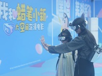 Visitors are watching the world's first VR movie ''Me and Crayon Shin-chan'' through multimedia smart VR glasses in Hangzhou, China, on Augu...