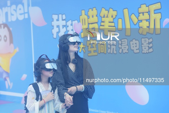 Visitors are watching the world's first VR movie ''Me and Crayon Shin-chan'' through multimedia smart VR glasses in Hangzhou, China, on Augu...