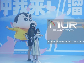 Visitors are watching the world's first VR movie ''Me and Crayon Shin-chan'' through multimedia smart VR glasses in Hangzhou, China, on Augu...