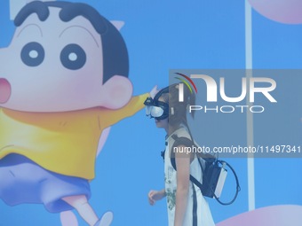 Visitors are watching the world's first VR movie ''Me and Crayon Shin-chan'' through multimedia smart VR glasses in Hangzhou, China, on Augu...