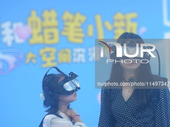 Visitors are watching the world's first VR movie ''Me and Crayon Shin-chan'' through multimedia smart VR glasses in Hangzhou, China, on Augu...