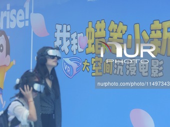 Visitors are watching the world's first VR movie ''Me and Crayon Shin-chan'' through multimedia smart VR glasses in Hangzhou, China, on Augu...