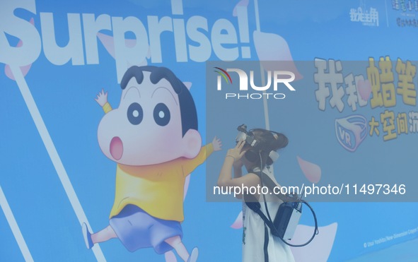 Visitors are watching the world's first VR movie ''Me and Crayon Shin-chan'' through multimedia smart VR glasses in Hangzhou, China, on Augu...