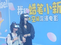 Visitors are watching the world's first VR movie ''Me and Crayon Shin-chan'' through multimedia smart VR glasses in Hangzhou, China, on Augu...