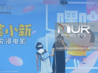 Visitors are watching the world's first VR movie ''Me and Crayon Shin-chan'' through multimedia smart VR glasses in Hangzhou, China, on Augu...