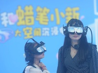 Visitors are watching the world's first VR movie ''Me and Crayon Shin-chan'' through multimedia smart VR glasses in Hangzhou, China, on Augu...