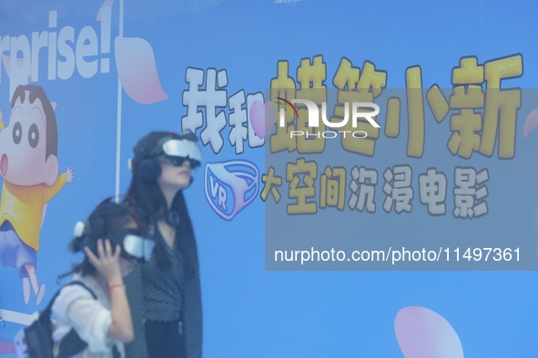 Visitors are watching the world's first VR movie ''Me and Crayon Shin-chan'' through multimedia smart VR glasses in Hangzhou, China, on Augu...