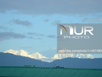 The peak of Mount Kanchenjunga in the eastern Himalayan range, the third highest mountain in the world, is seen from Siliguri, India, on Aug...