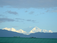 The peak of Mount Kanchenjunga in the eastern Himalayan range, the third highest mountain in the world, is seen from Siliguri, India, on Aug...