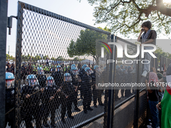 Thousands are marching outside the DNC in Chicago, Illinois, on August 19, 2024, to protest the war on Gaza. At the end of the march, a grou...