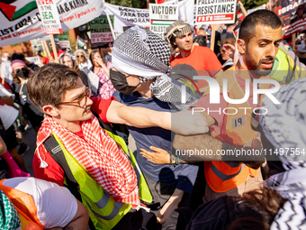 Thousands are marching outside the DNC in Chicago, Illinois, on August 19, 2024, to protest the war on Gaza. At the end of the march, a grou...