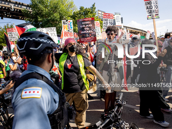 Thousands are marching outside the DNC in Chicago, Illinois, on August 19, 2024, to protest the war on Gaza. At the end of the march, a grou...