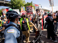 Thousands are marching outside the DNC in Chicago, Illinois, on August 19, 2024, to protest the war on Gaza. At the end of the march, a grou...