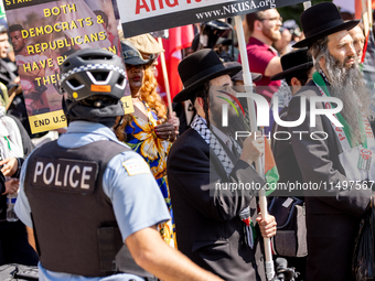 Thousands are marching outside the DNC in Chicago, Illinois, on August 19, 2024, to protest the war on Gaza. At the end of the march, a grou...