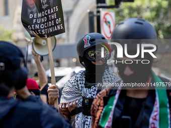 Thousands are marching outside the DNC in Chicago, Illinois, on August 19, 2024, to protest the war on Gaza. At the end of the march, a grou...